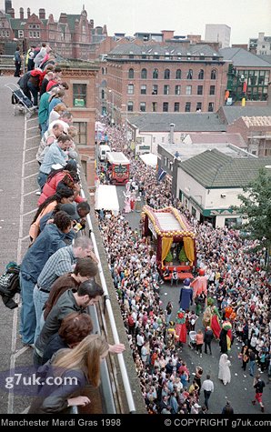 Crowds line the streets and every vantage point